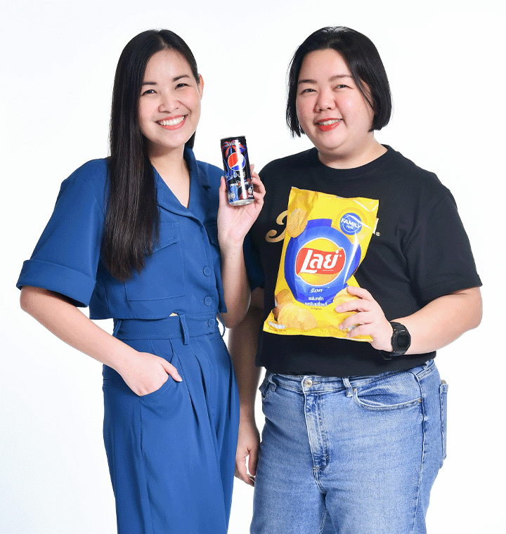 Women holding Pepsi can and Lay's bag