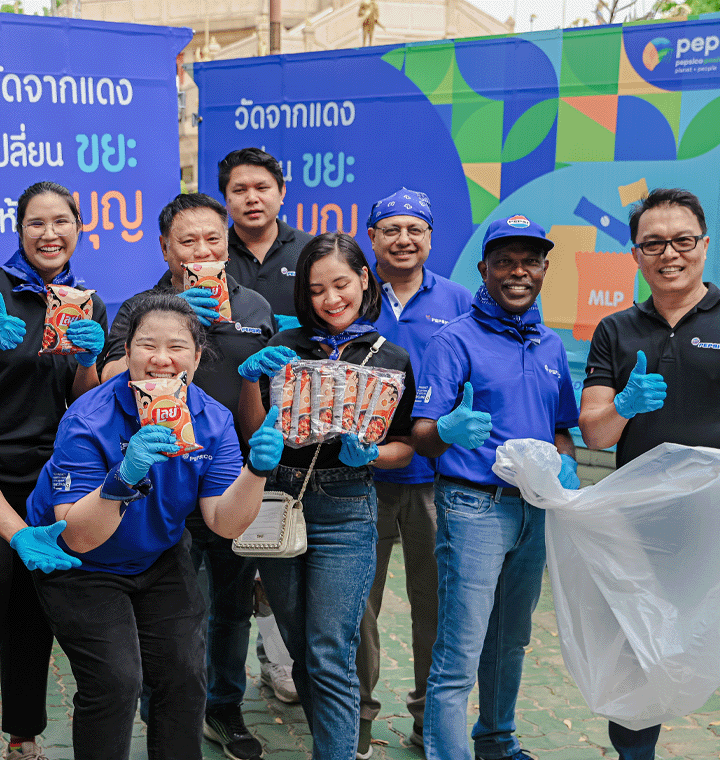 Employees holding Lay's bags at a PepsiCo Positive event